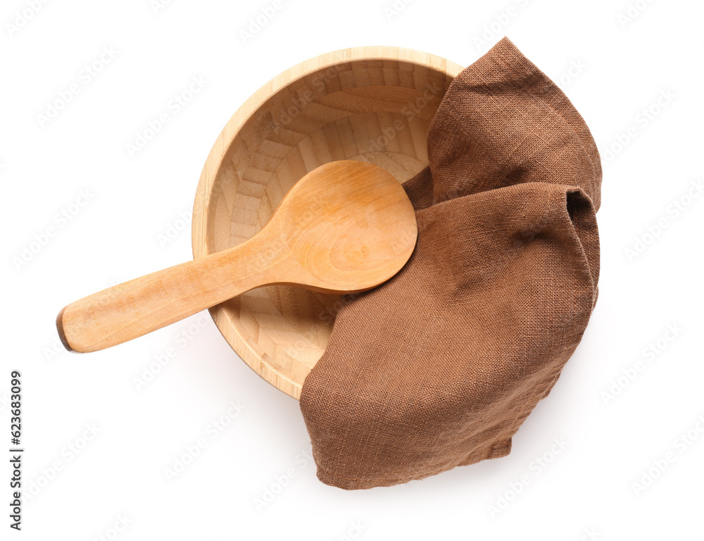 Wooden bowl, spoon and napkin on white background
