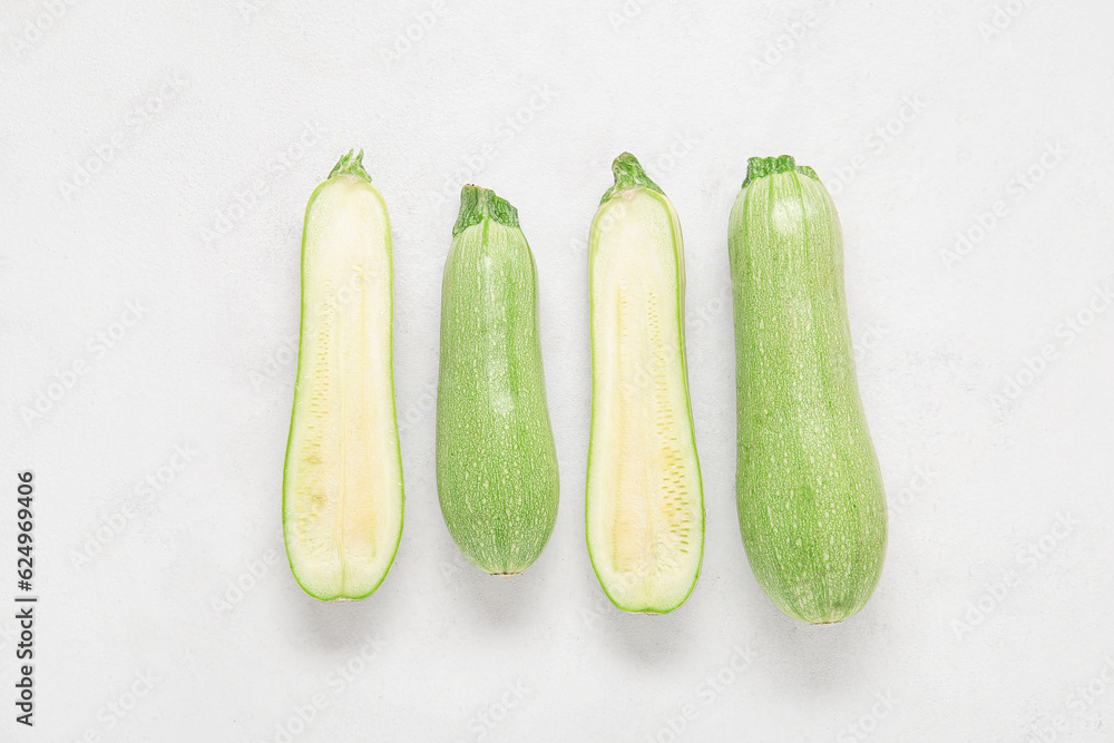 Fresh green zucchini on light background