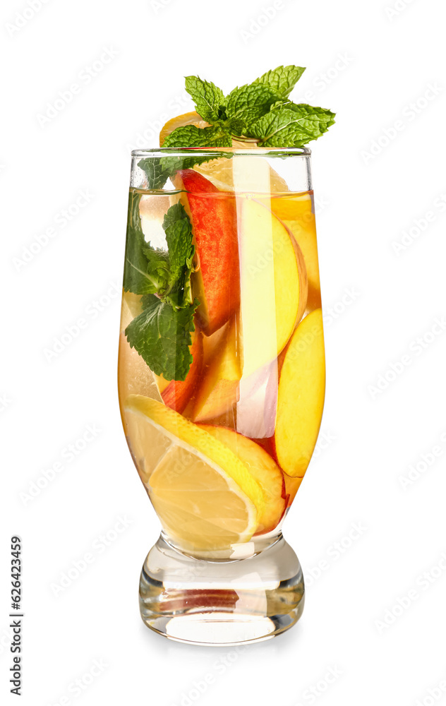 Glass of fresh peach lemonade with mint on white background