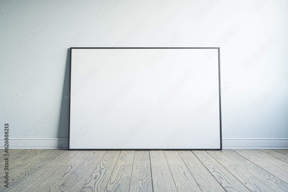 Front view on blank white picture frame with place for your logo or text on light wall background in