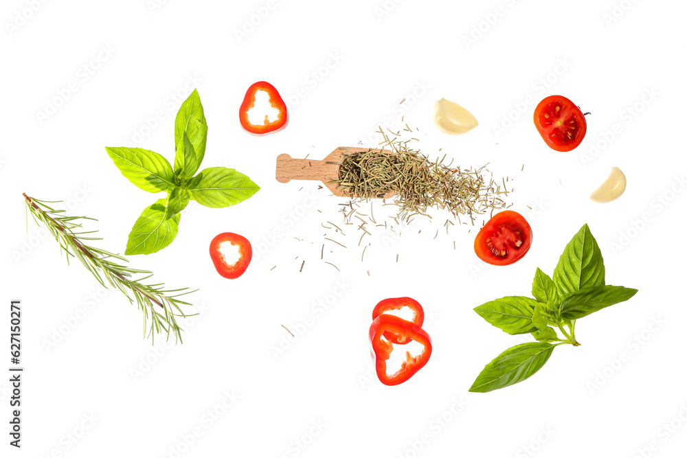 Flying spices, herbs and vegetables on white background