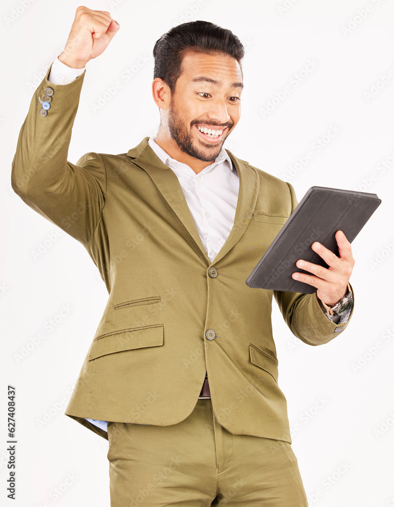 Happy asian man, tablet and fist pump in celebration for winning, discount or sale against a white s