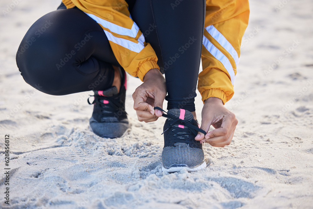 Beach, closeup and woman tie shoes for an outdoor run for fitness, health and wellness by seaside. S