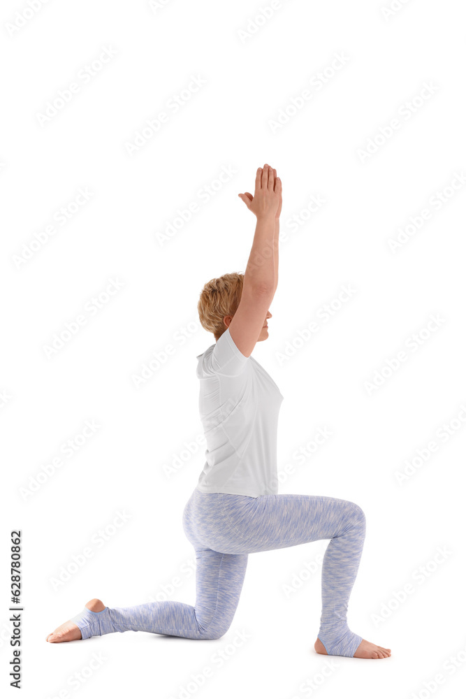 Sporty mature woman practicing yoga on white background