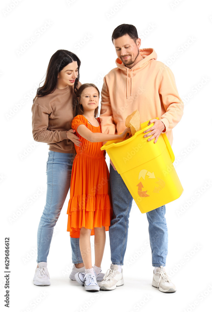 Little girl with her parents throwing paper garbage in recycle bin on white background