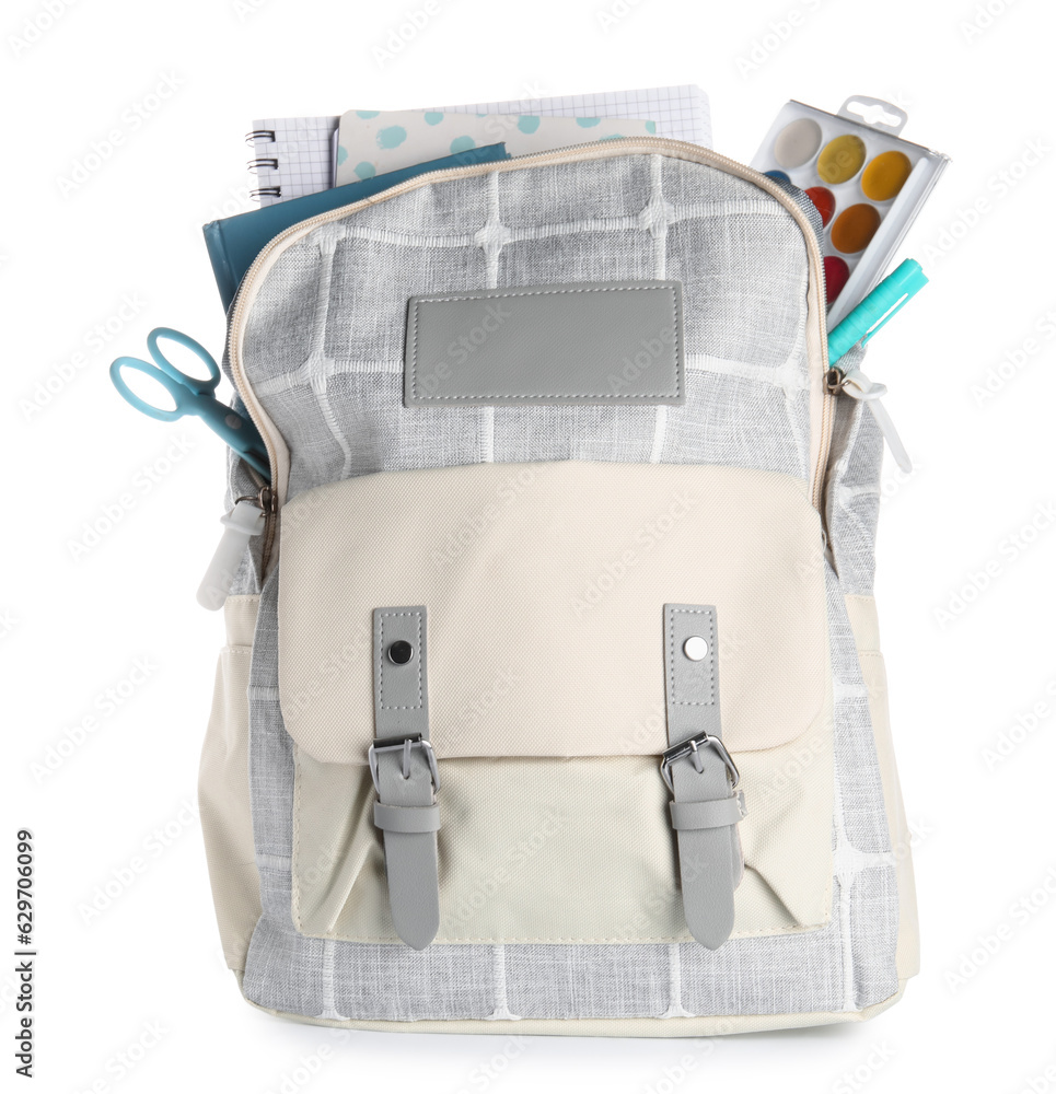 Grey school backpack with notebooks and watercolors on white background