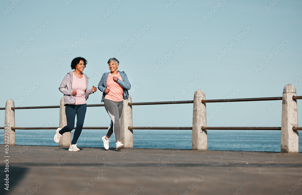 Senior women, fitness and running at beach for health, wellness and exercise in nature together. Eld