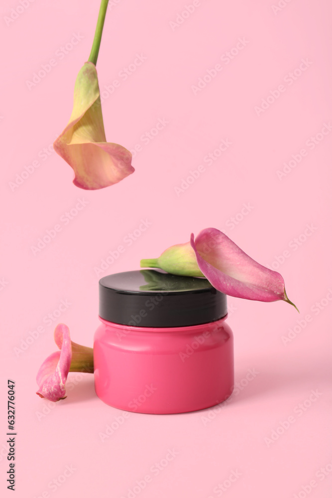 Jar of cosmetic product and beautiful calla lilies on color background
