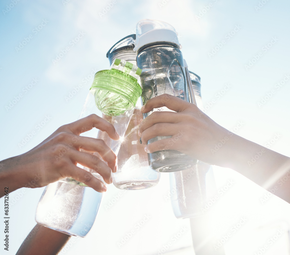 Hands, water bottle and toast to fitness together after workout, exercise or training outdoor with t