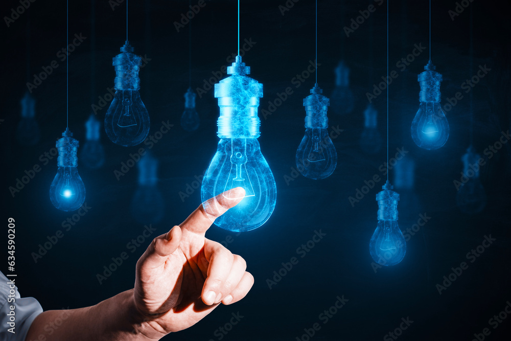 Bright idea and creativity concept with man finger touching digital blue glowing light bulb on abstr