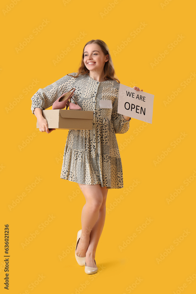 Female seller with shoes and sale sign on yellow background