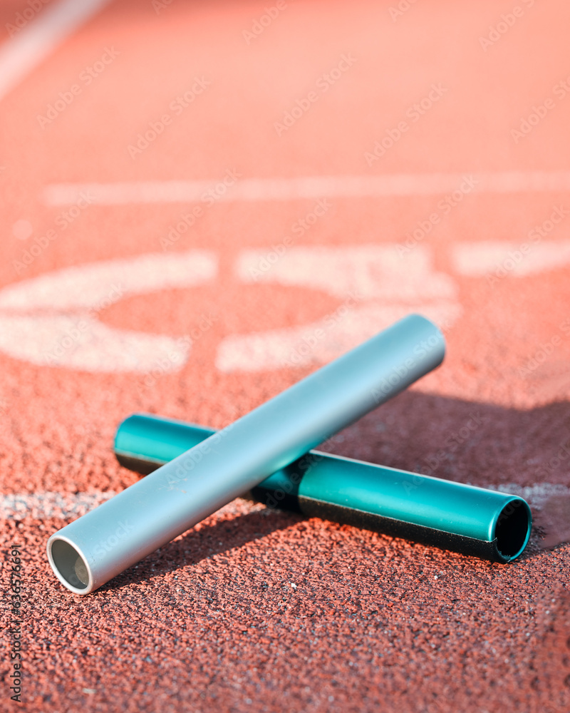 Sports, track and closeup of baton in a stadium for a relay race, marathon or competition. Fitness, 