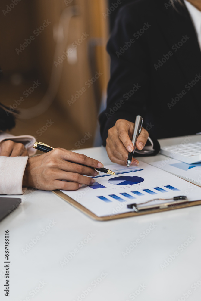 Businesswoman meeting to discuss analysis of growth graphs and financial charts for investment plann