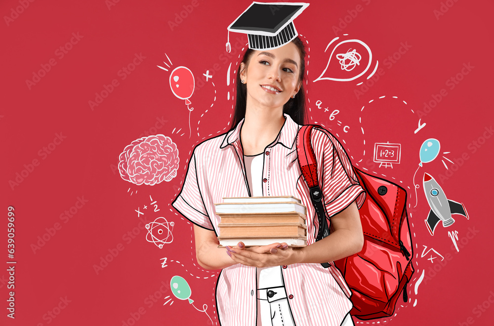 Portrait of female student with books on red background