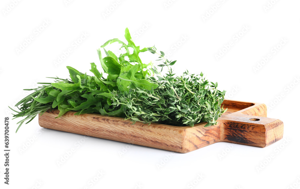 Wooden board with fresh herbs isolated on white background