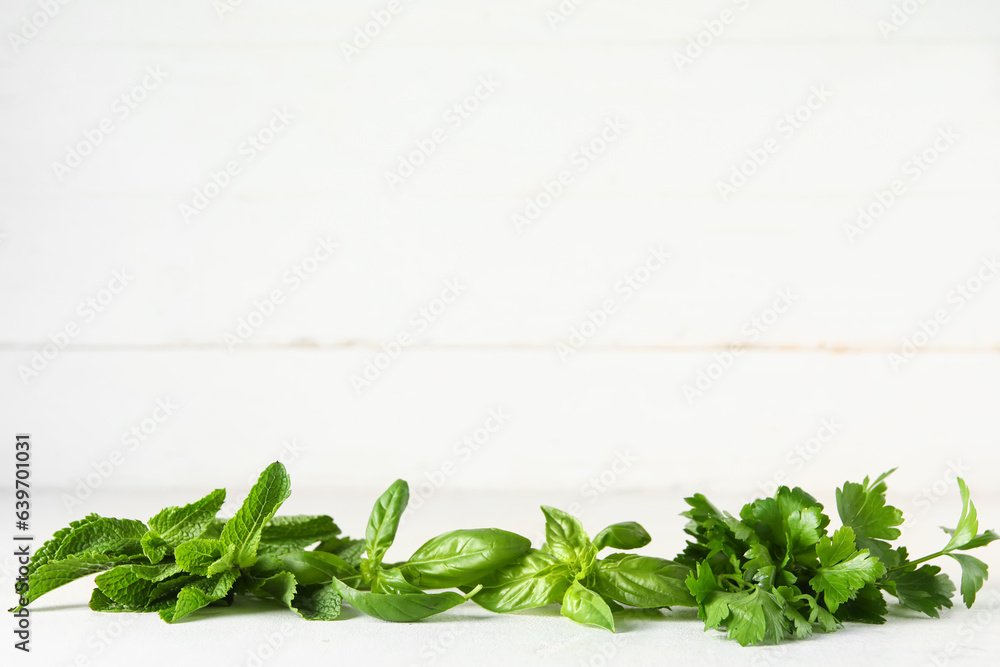 Fresh aromatic herbs on light table
