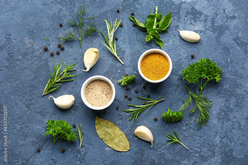 Composition with spices and herbs on color background