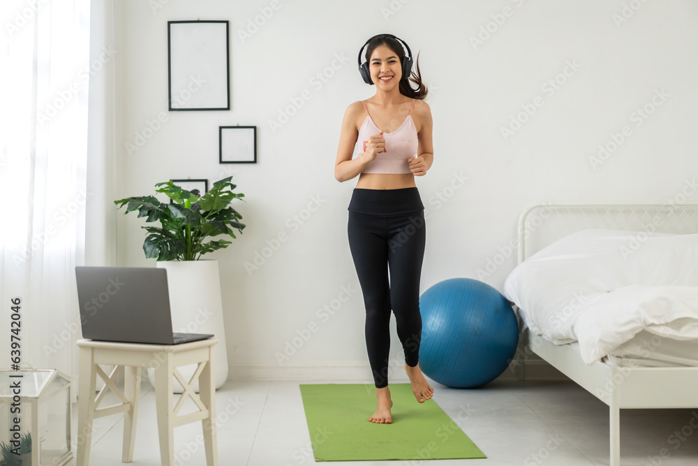 Portrait of sport slim fit strength asian woman training in sportswear sitting relax and practicing 