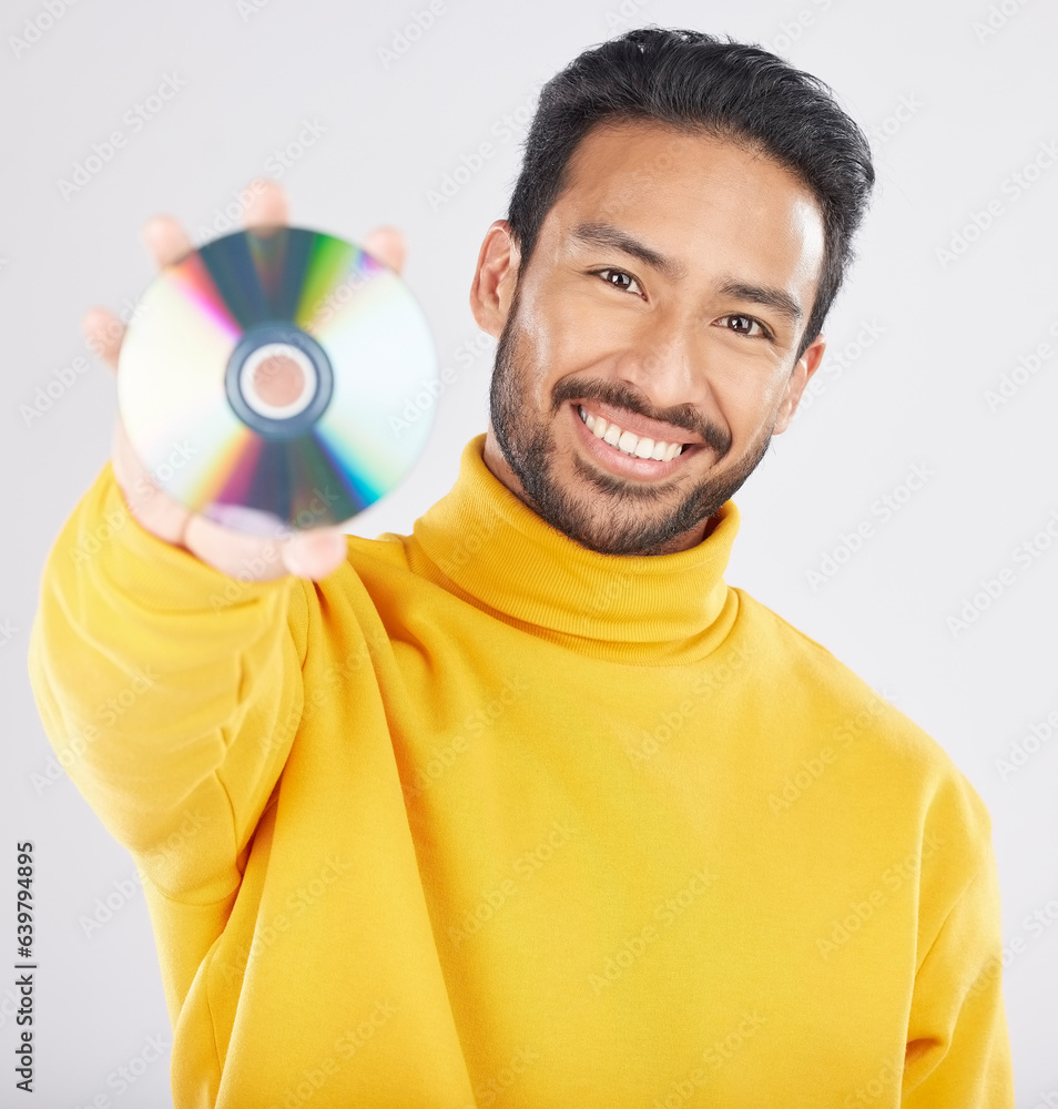 Man, cd and smile in studio portrait for music, tech or software for data, info or sound by white ba