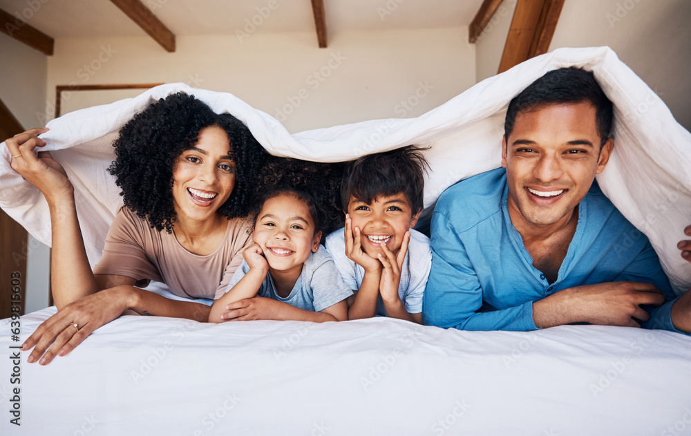 Happy, smile and portrait of a family with a blanket for relaxing, bonding or resting together. Happ