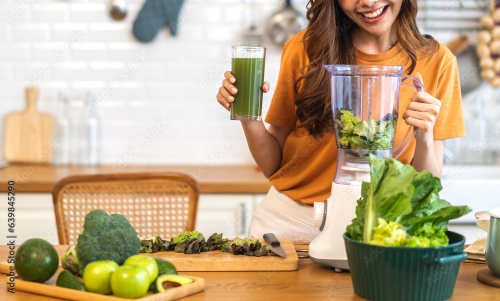 Portrait of beauty healthy asian woman making green vegetables detox cleanse and green fruit smoothi