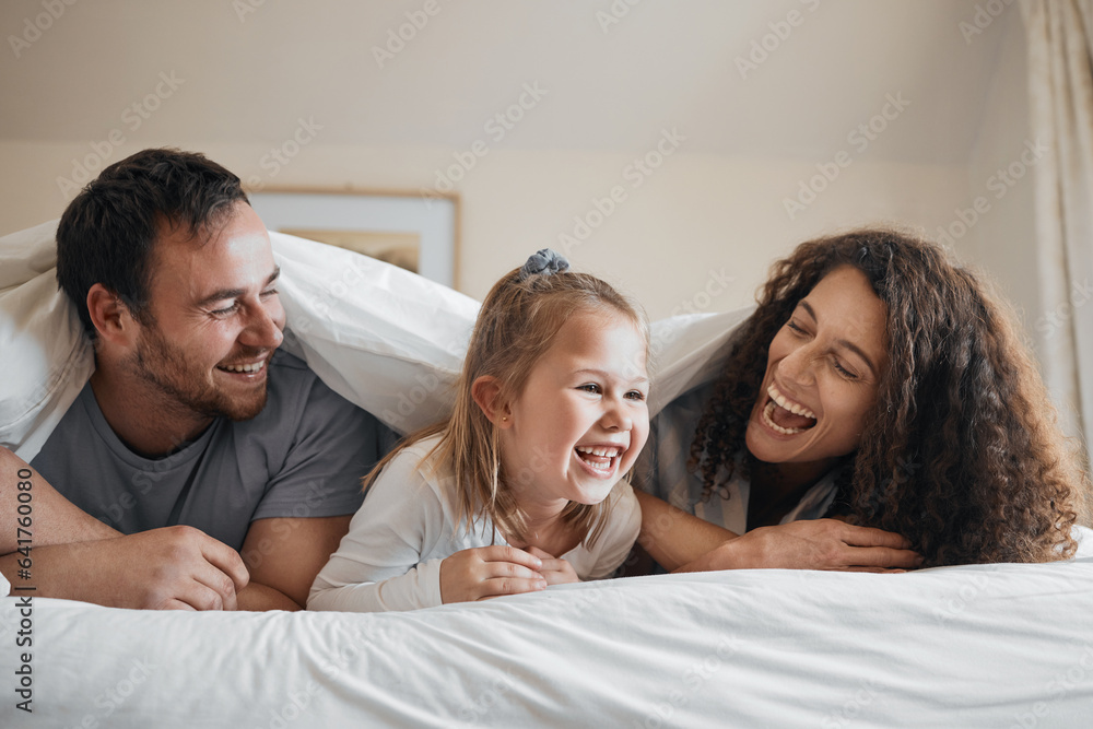 Laugh, happy and family in bed together bonding with comic, comedy or funny joke together. Smile, lo