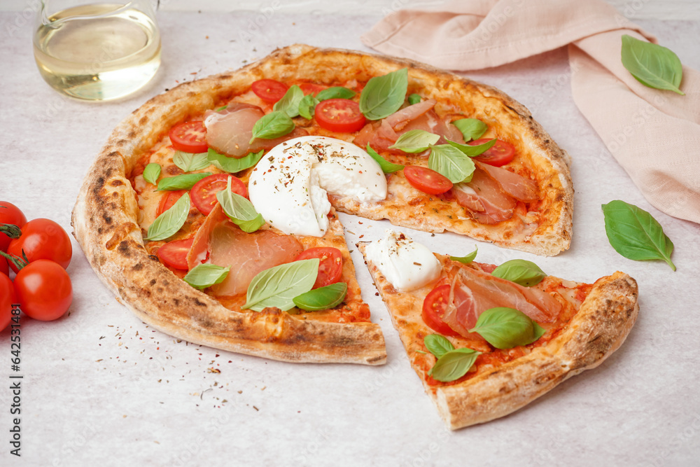 Tasty pizza with Burrata cheese on light background