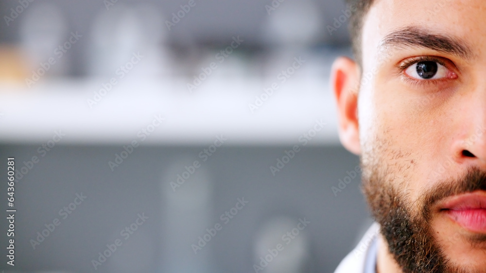 Face of serious young male in a high stress environment. Closeup of a business man head with a beard