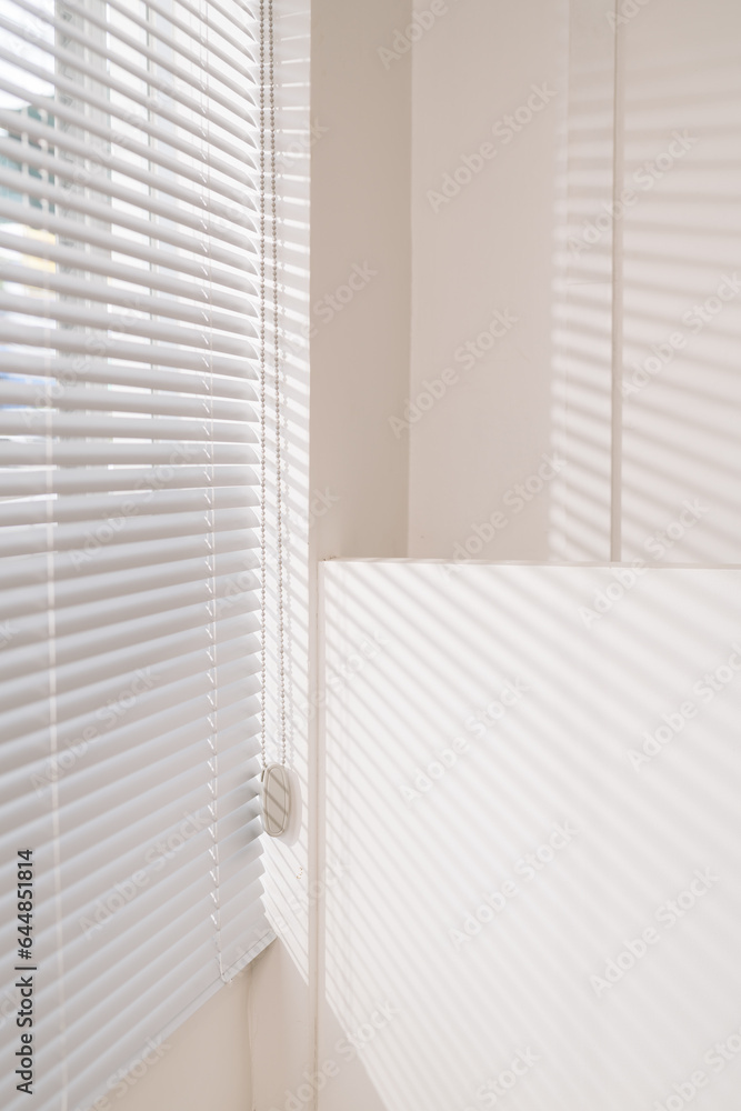 Vertical image of Window blinds of office.