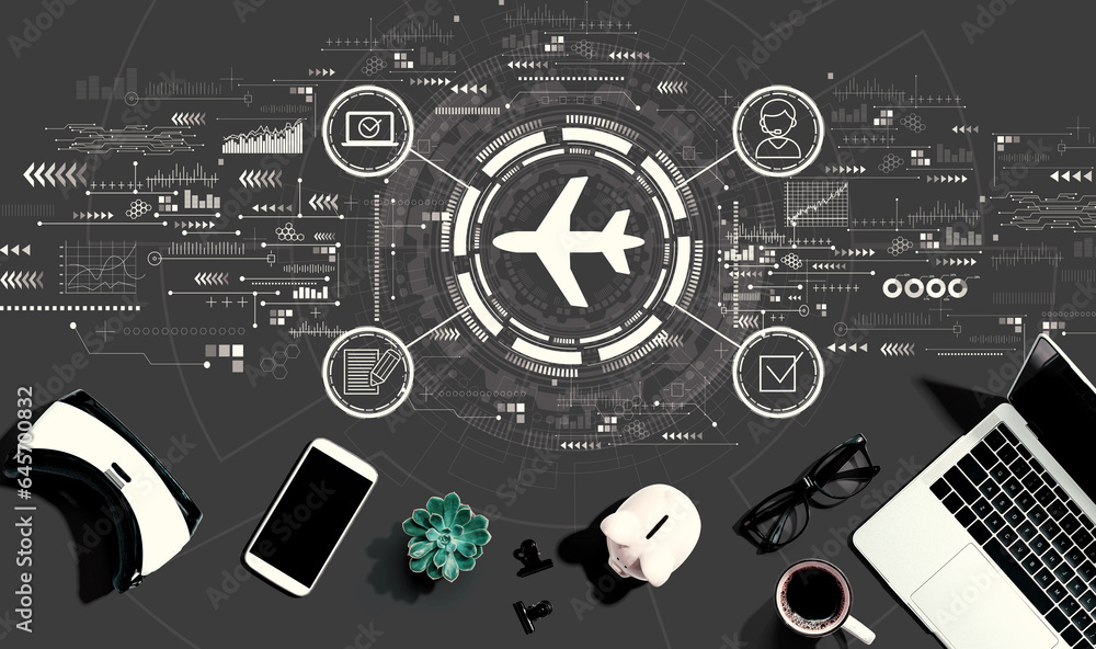 Flight ticket booking concept with electronic gadgets and office supplies - flat lay