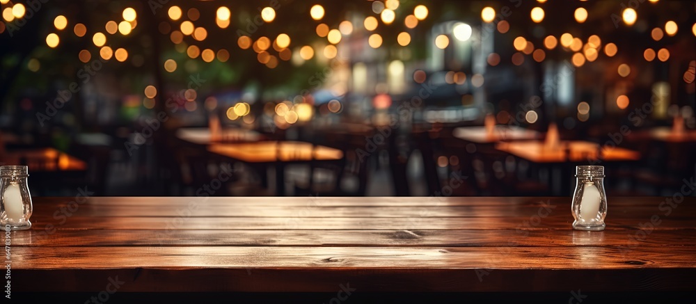 Montage of product display using empty wooden table and coffee shop background with bokeh