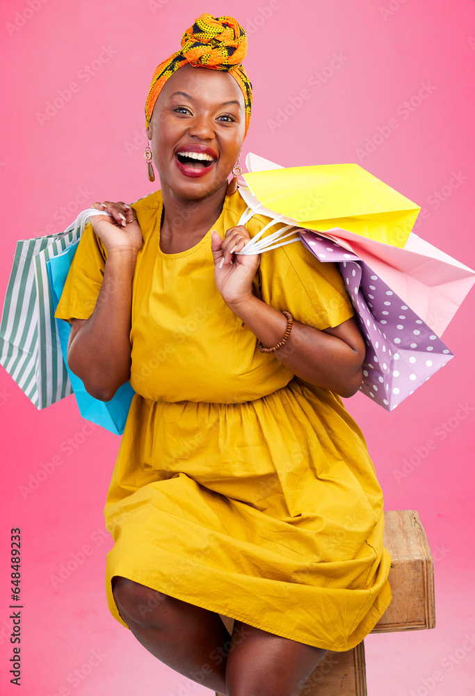 Shopping bag, studio portrait and black woman excited for discount promotion, fashion spree choice or commerce deal. Market product, package or African customer with retail present on pink background