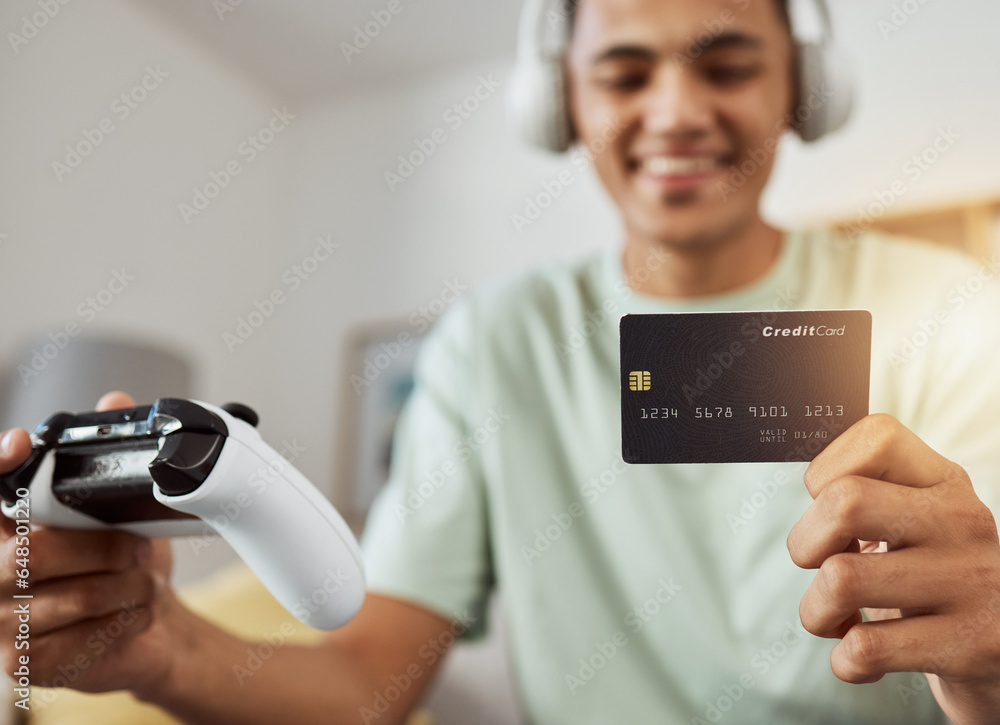 Headphones, credit card and man on esports video game ecommerce for purchase with controller in virtual challenge. Internet, user experience and person or esport gamer streaming sports games online