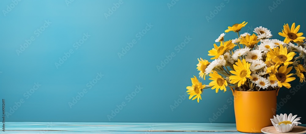 Colorful mug on wooden background with spring bouquet