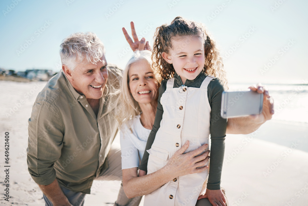Family, selfie and beach holiday with peace sign, grandparents and young girl with a smile. Happy, child and love at the sea and ocean with a profile picture for social media on summer vacation
