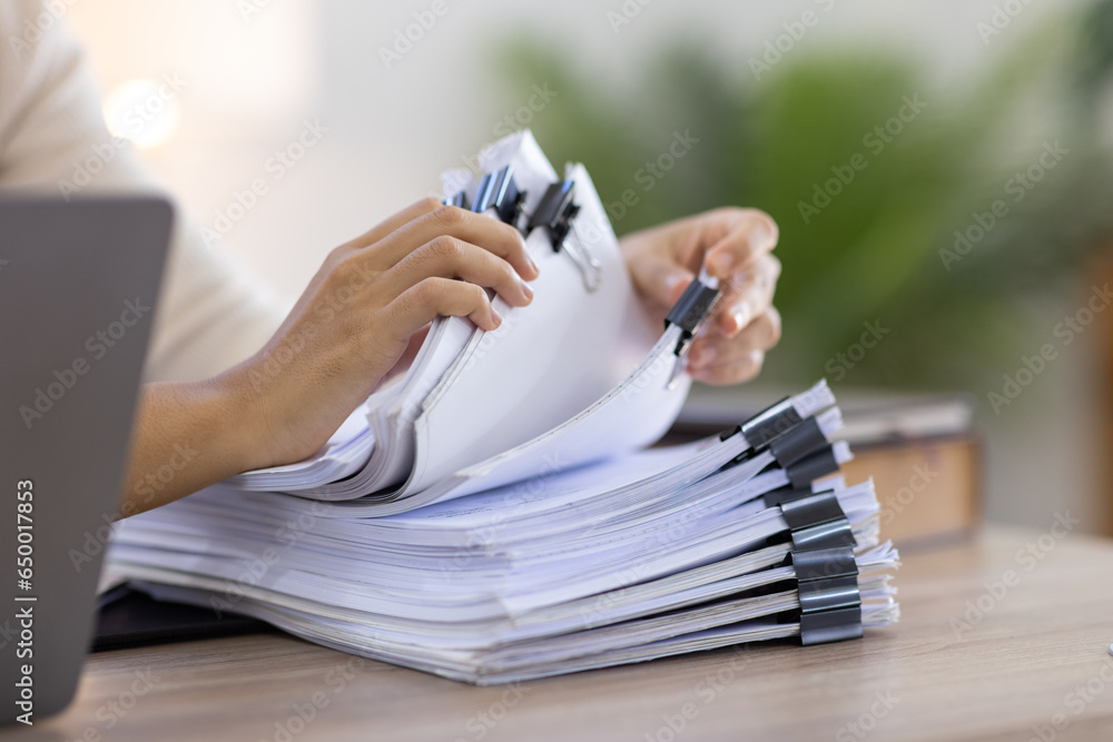 Business Documents, Auditor businesswoman checking searching document legal prepare paperwork or report for analysis TAX time,accountant Documents data contract partner deal in workplace office	