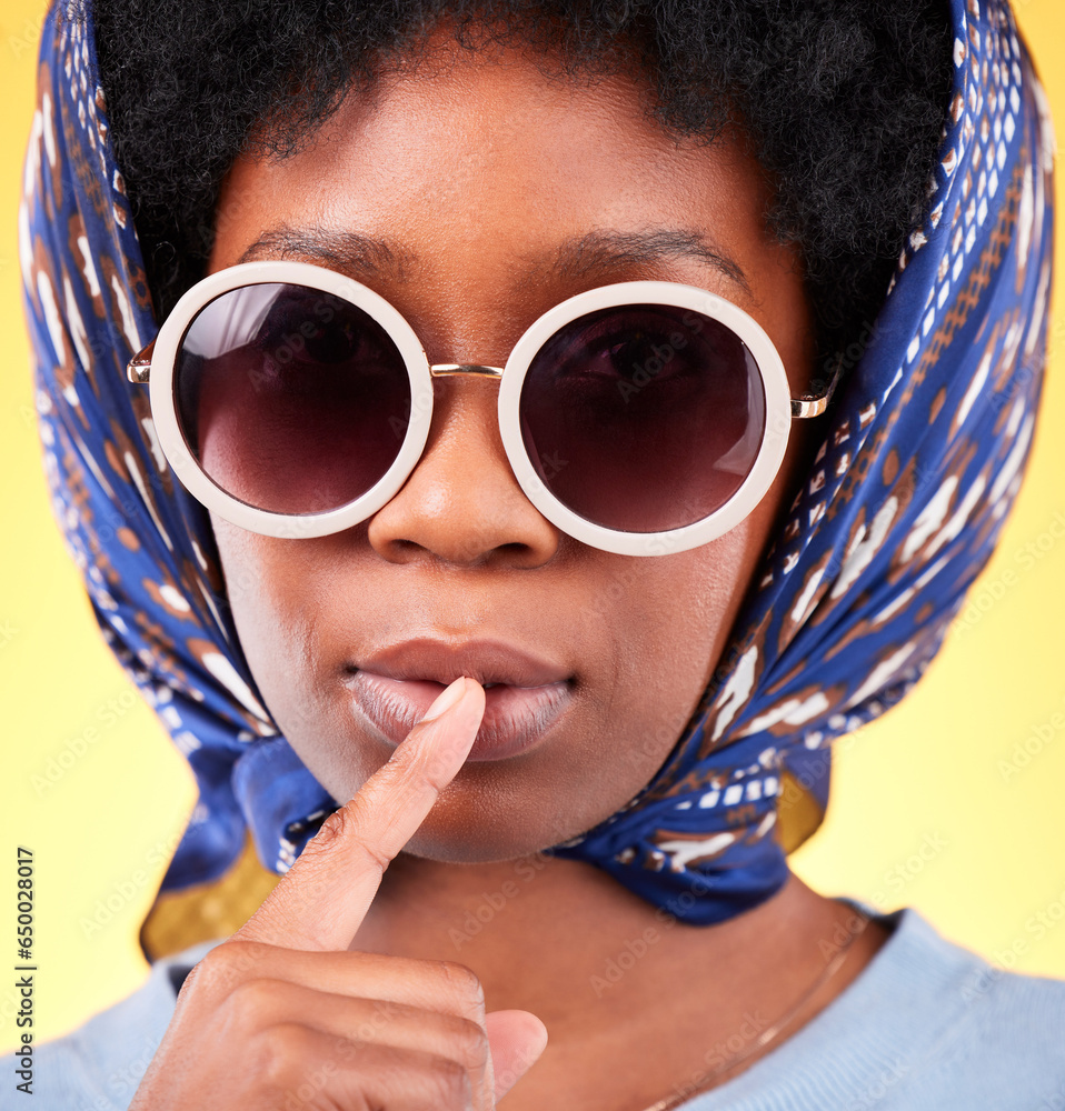 Fashion, silence and sunglasses with portrait of black woman in studio for vintage, secret and beauty. Mystery, whisper and rumor with person and scarf on yellow background for frames and style