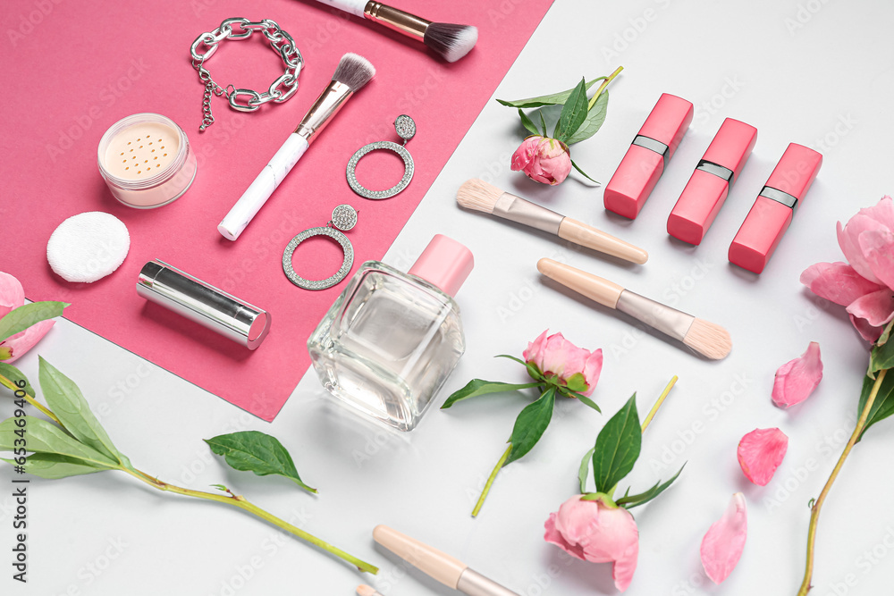 Composition with female accessories, cosmetics, makeup brushes and peony flowers on color background