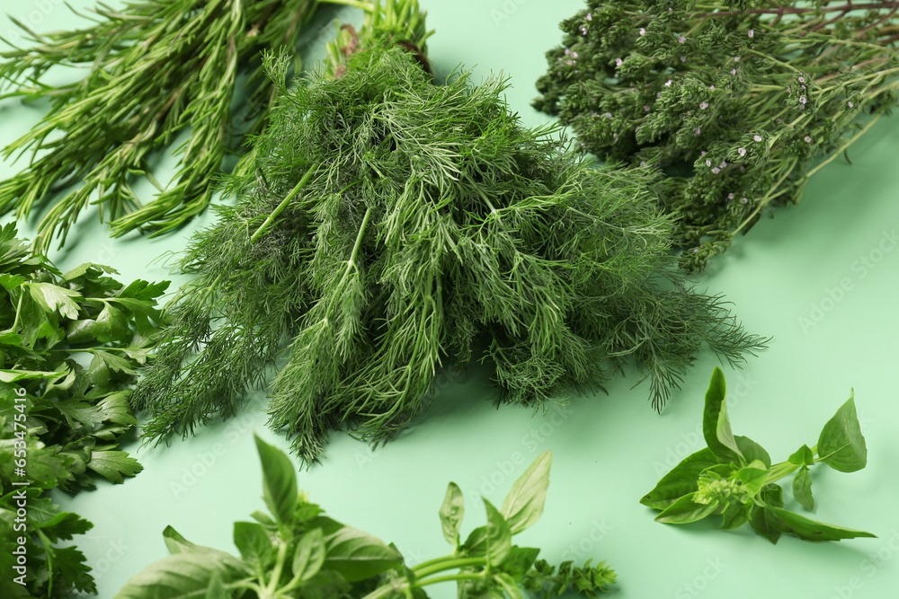 Different fresh herbs on color background, closeup