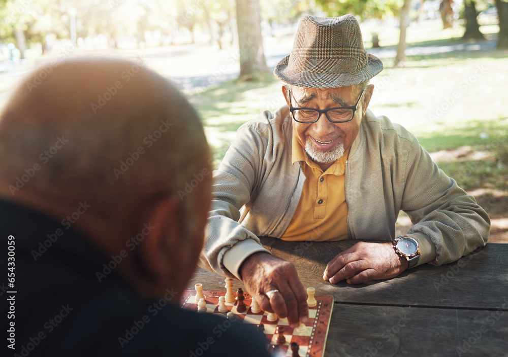 Friends, senior and game of chess outdoor and happy or playing with strategy or thinking challenge in retirement. Winning, boardgame and elderly person with king in checkmate in park, woods or nature