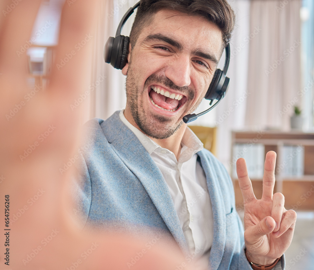 Portrait, selfie or happy man in a call center office on a break to post a photograph on social media online. CRM, peace sign or male sales agent taking fun pictures to relax in workplace with smile