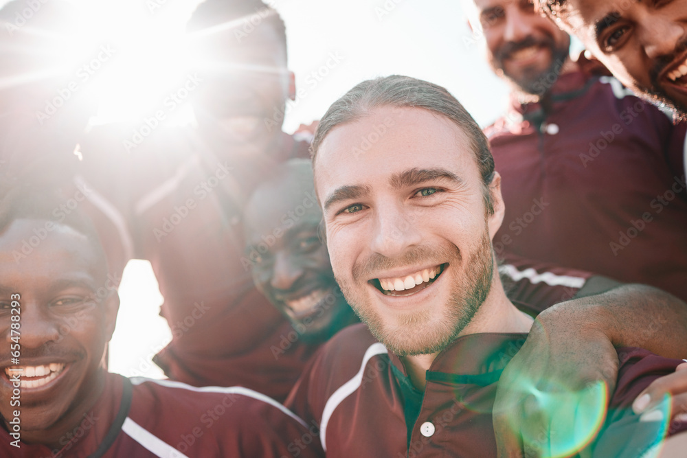 Football team, portrait and happy on sports field with victory, pride and final competition. Men, diversity and sport captain in collaboration in teamwork, lens flare and champion close up in smiles
