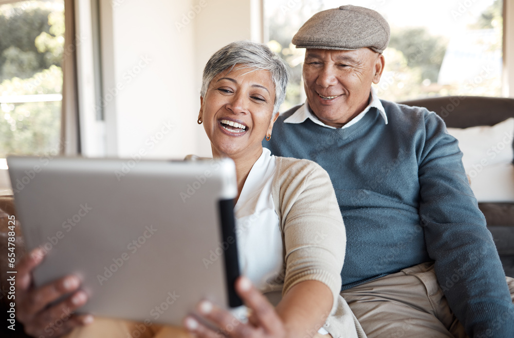 Tablet, video call and senior couple on a sofa relax, happy and talking at home together. Digital, communication and old people in a living room with online conversation, smile and enjoy retirement