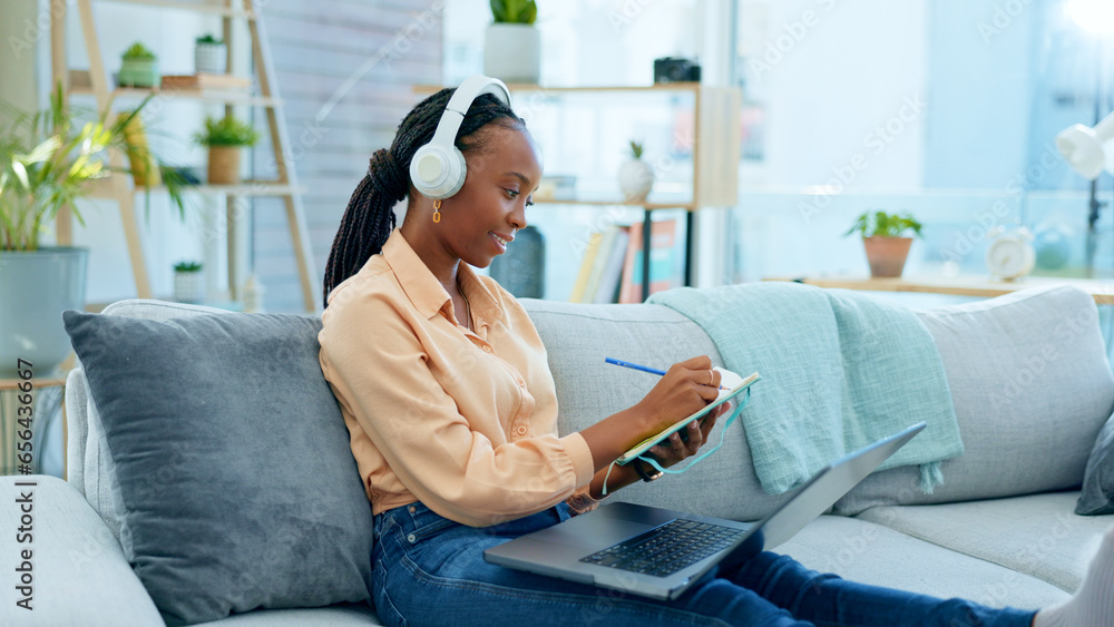 Video call, laptop and black woman doing remote work on couch in a home writing notes in webinar or e learning. Sofa, information and student working with online technology in apartment for research