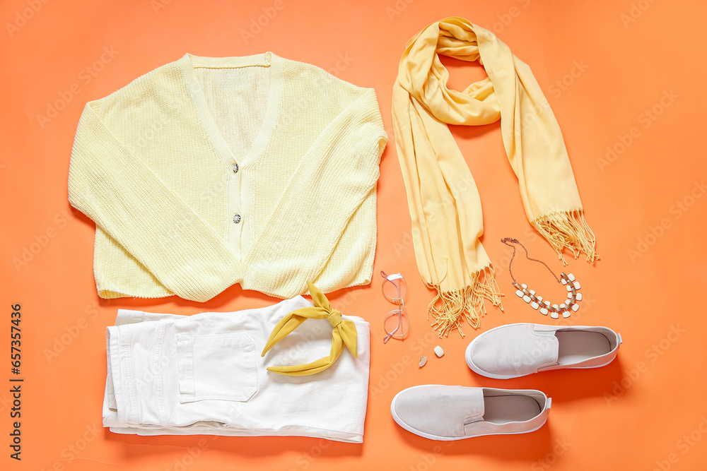 Composition with female clothes, shoes and accessories on color background