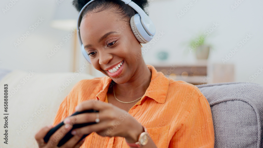 Smartphone games, headphones or woman in home on sofa for playing online subscription, digital gaming or connection. Happy african person, video game or mobile in living room for streaming multimedia