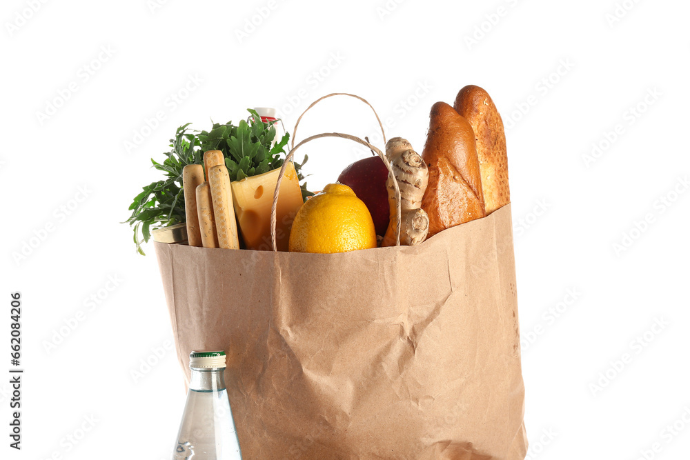 Paper bag full of food and bottle of water on white background