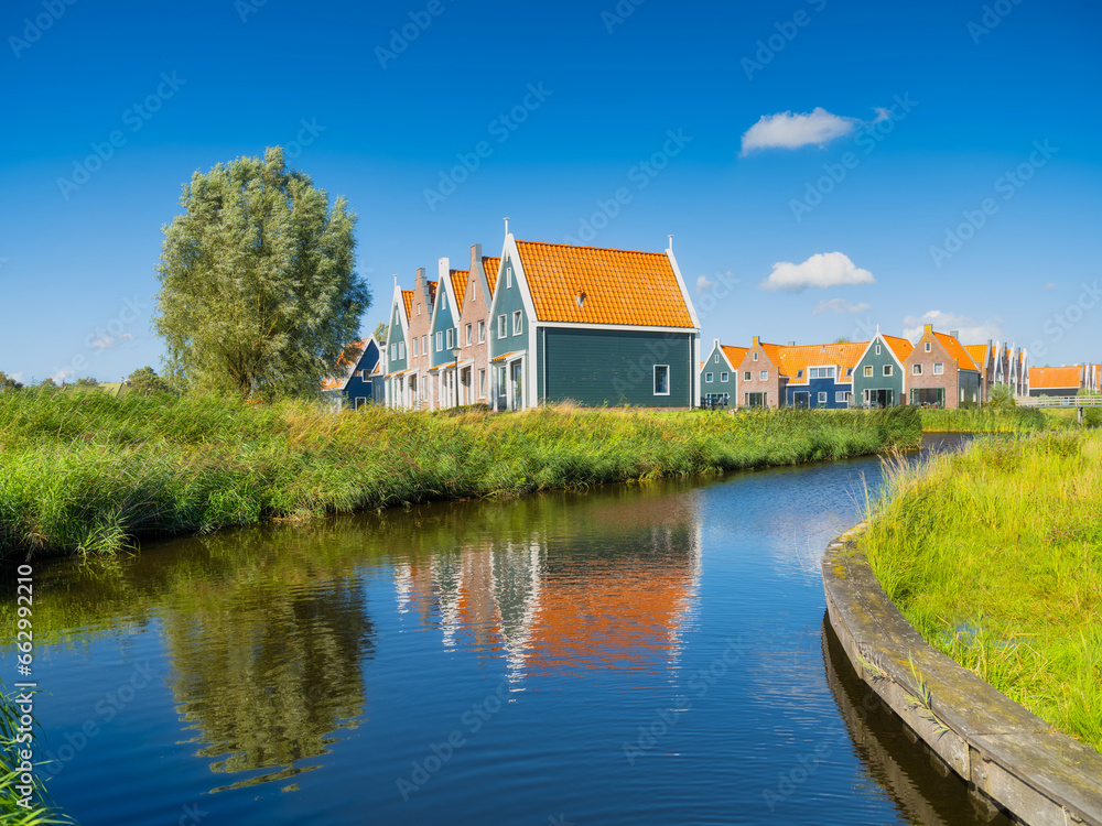 A row of houses in the Volendam, Netherlands. Old buildings. Architecture and construction. Photo for background and wallpaper.