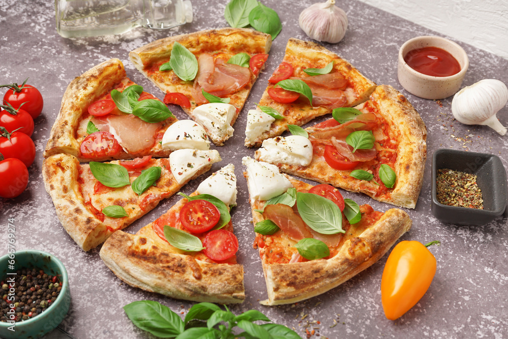 Slices of tasty pizza with Burrata cheese on grey background