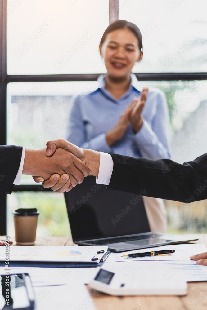 Businessmen shaking hands at a meeting of business partners.